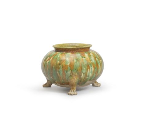 A SANCAI-GLAZED TRIPOD JARTang DynastyOf compressed globular shape, rising from three lion-paw  legs to an everted rim, the e