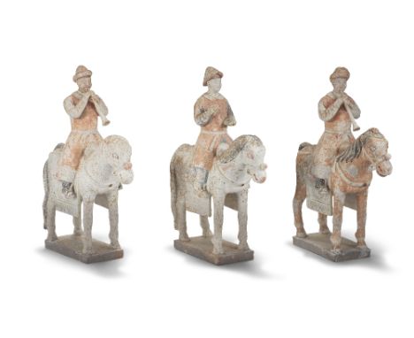 A SET OF THREE PAINTED POTTERY EQUESTRIAN MUSICIANSYuan/Ming DynastyComprising three musicians, all facing forwards seated on