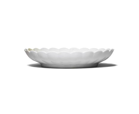 A RARE WHITE-GLAZED 'CHRYSANTHEMUM' DISHYongzheng six-character mark and of the periodFinely potted with lobed sides and foli