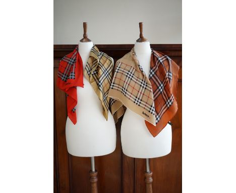 Four vintage Burberry silk scarves, in colour variations of the iconic 1920s check design, two in silk chiffon incorporating 