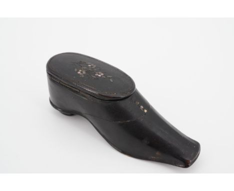 A 19th Century novelty snuff box in the form of a lady's shoe, of lacquered papier mache, decorated with abalone inlaid flowe