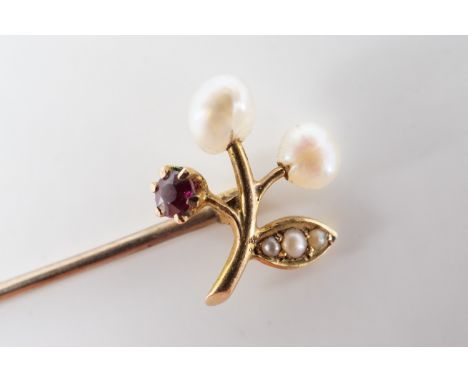 An antique seed pearl, almandine garnet and high-carat yellow metal stick pin, the terminal in the form of a fruiting sprig, 