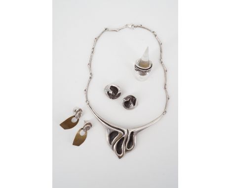 A contemporary white metal demi parure comprising Nikos necklace, matched ring, ear clips and pendant stud earrings, each of 