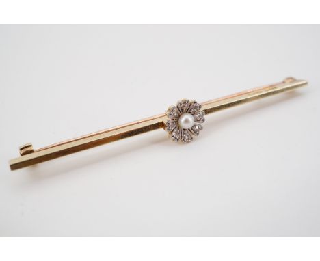 An early 20th Century high carat yellow metal, diamond and pearl bar brooch, the planer bar centrally surmounted by a flower 