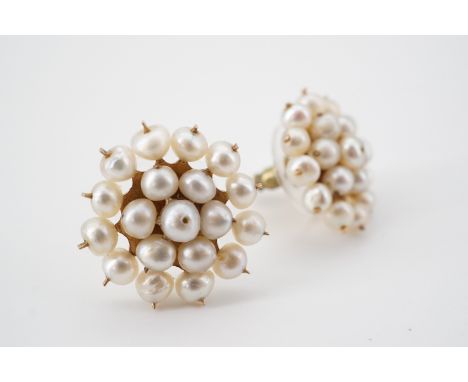 A pair of yellow metal and seed pearl stud earrings, in a flower head cluster arrangement, stamped '9ct', face 1.8 cm, 4.2g 