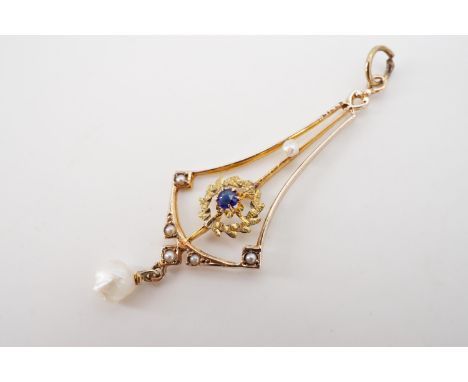 An early 20th Century Aesthetic-influenced sapphire doublet and baroque pearl pendant, of delicate openwork design, centred b