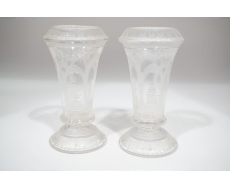 A pair of Victorian spill or posy vases, of trumpet form with inverted rims, finely wheel cut in depiction of a boy playing a