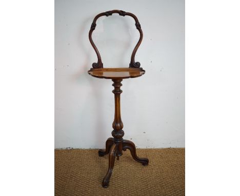 A Victorian walnut tripod screen with shelf, 110 cm