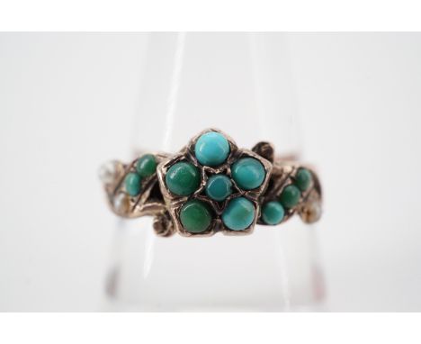 A Victorian turquoise, seed pearl and 9ct rose gold dress ring, with central flower head cluster and gem set scrolling should