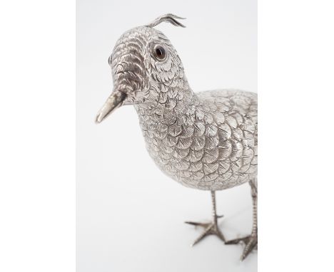 An early 20th Century Dutch silver novelty pounce pot / sander naturalistically modelled in the form of a bird, with inset gl
