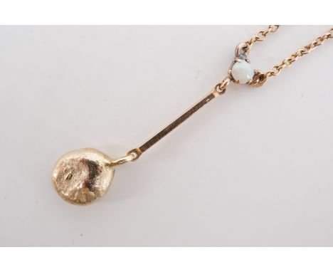 An antique yellow-metal and opal necklace, having a claw-set opal cabochon, above a dependent blade bar and 'gold nugget' dro
