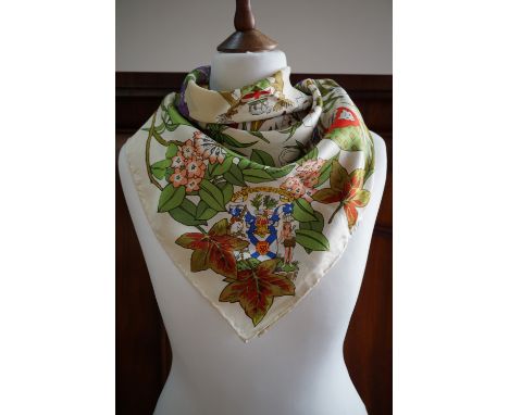 A vintage Liberty of London 'Je Me Souviens' silk scarf, decorated with bold blossoms and coats of arms, 68 x 68 cm 
