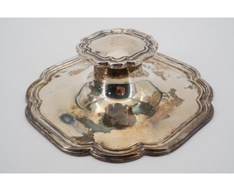 A George V silver capstan inkwell, with cusped and reeded borders, marks rubbed, Sheffield, 1927, with clear glass liner, loa