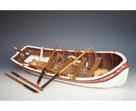 A wooden scale model of an 18th Century ship's boat from HMS Victory, 65 cm