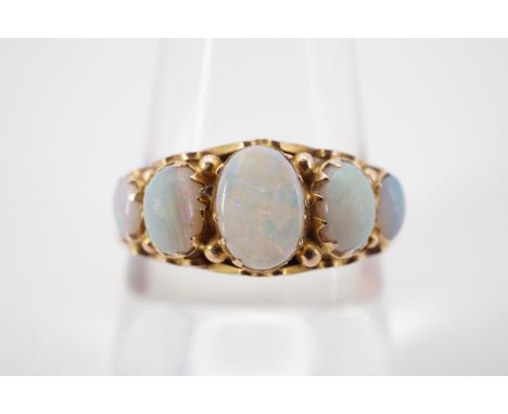 An antique five-stone 9ct gold opal cabochon ring, claw and pellet-set in a graded arrangement, the central stone of approxim