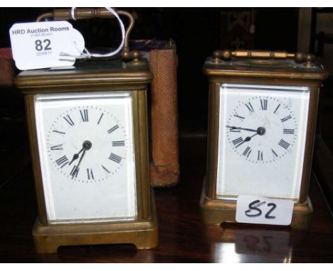 A brass cased carriage clock in travelling case, together with one other
