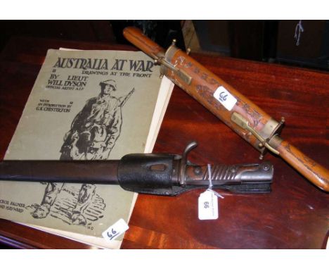 A sword bayonet with metal scabbard, together with "Australia at War" drawing book, etc.