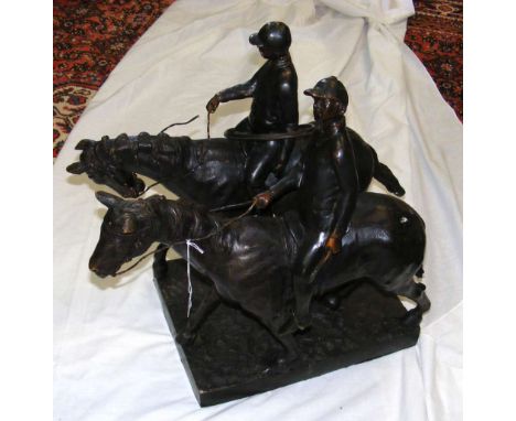 A bronze group of two huntsmen, one with hunting horn, on rectangular base - 52cm high overall