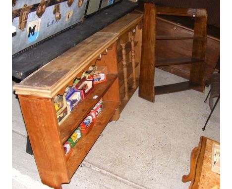 Two pine hanging shelf units, together with an oak bookcase