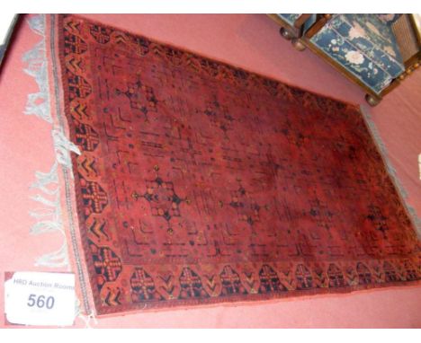 UPSTAIRS - Middle Eastern style carpet with red ground and geometric border - 210cm x 122cm