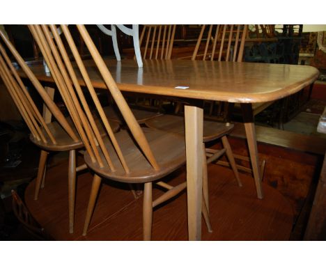 An Ercol light elm dining table; together with a set of four Ercol light elm stickback dining chairs (5)