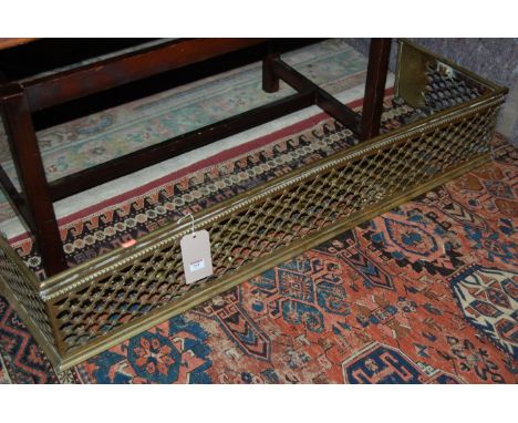 A Victorian brass trellis pattern fire fender; together with a collection of Victorian brass fire tools