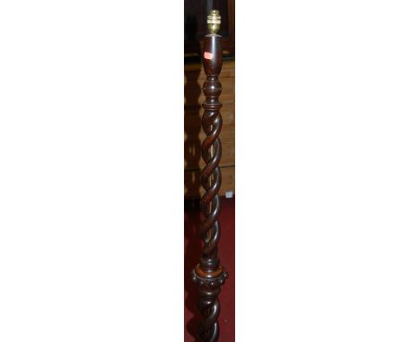 A contemporary turned brass standard lamp; together with an oak double spiraltwist example (2) 