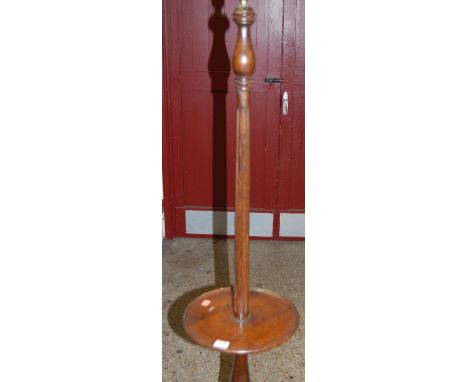 A reproduction beech standard lamp, having dished centre section