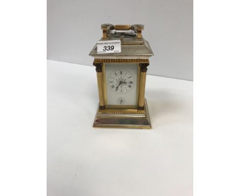 A mid-19th century carriage clock in architectural silver plated and lacquered brass case, the movement with white enamelled 