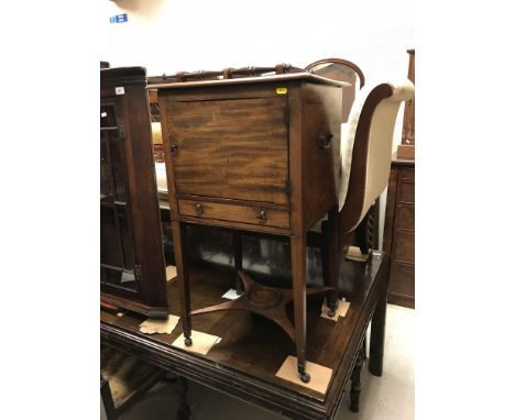 A Regency mahogany pot cupboard / wash stand, the top with moulded edge over a single door and slim drawer, raised on square 