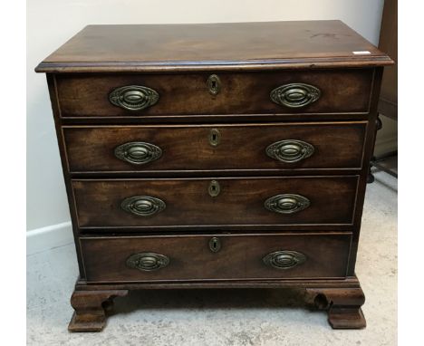 A late George III mahogany chest, the plain top with applied moulded edge over four long graduated drawers to heavy ogee brac