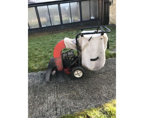 A heavy-duty garden leaf sweeper with 5hp Briggs &amp; Stratton petrol-driven engine, 75cm aperture x approx 147cm long