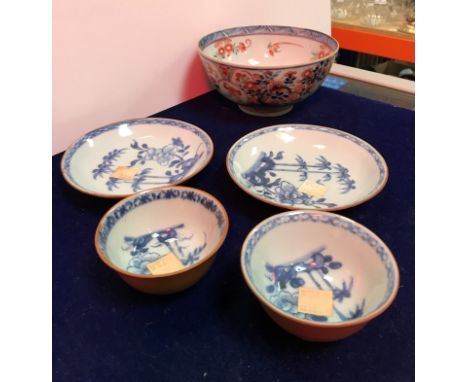 A 19th Century Chinese Imari bowl decorated green and oxide red enamels with medallions of figures and floral sprays over a b