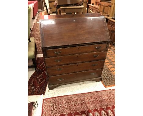 A 19th Century mahogany bureau, the fall front opening to reveal a fitted interior above four graduated drawers, raised on br