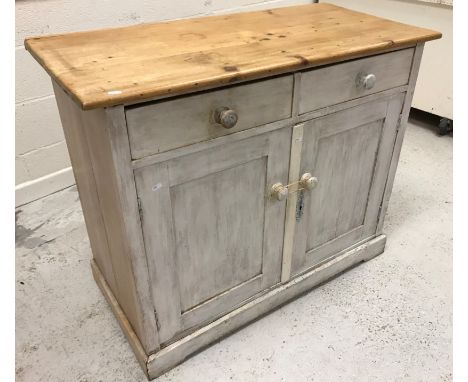 A circa 1900 Polish pine and painted dresser, the glazed two door upper section on a base of two drawers and two cupboard doo