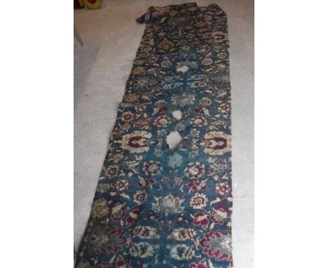 Five various Agra carpet fragments, all floral decorated on a blue ground, various sizes