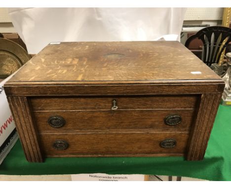 A Goldsmiths &amp; Silversmiths Company Limited of Regent Street oak cased canteen of plated cutlery, housed in a three drawe