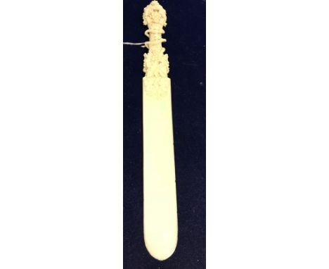 A fine 19th Century Dieppe ivory paper knife, the handle ornately carved with grape and vine, the blade of plain form, 29 cm 