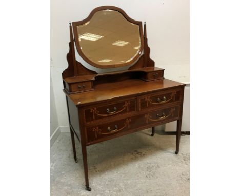 An Edwardian mahogany and inlaid two-piece bedroom suite, comprising chest of two short over three long drawers with marquetr
