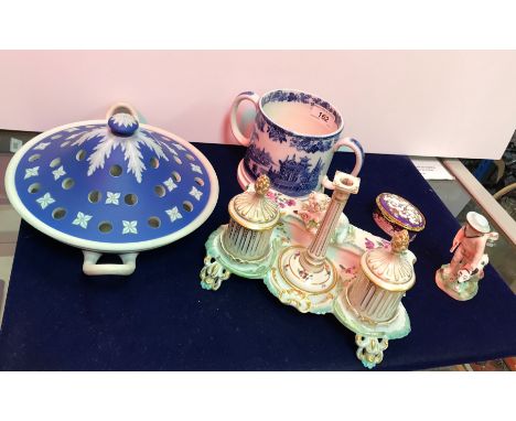 A 19th Century porcelain desk standish, the pen tray with lid decorated with garlanded sheep, the pounce pot and ink well of 