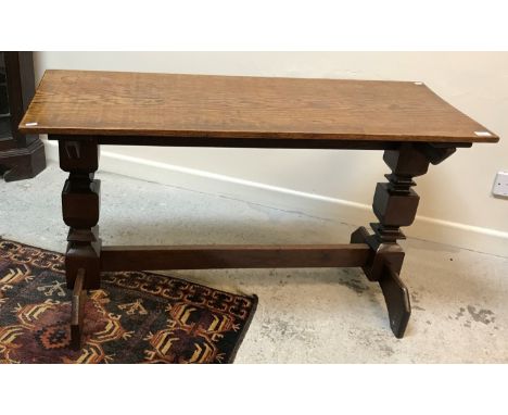 A 20th Century oak shove ha'penny table, the single piece top with scratched-in rudimentary board raised on square collared e