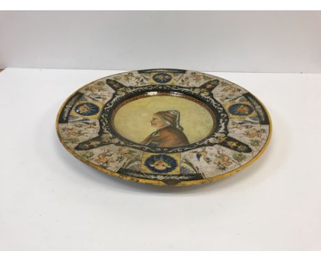 A 19th Century Italian majolica charger in the Urbino or Deruta manner, with central portrait medallion within a border of sa