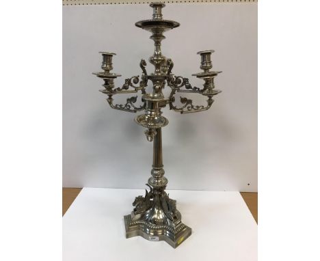 A Victorian silver plated table centre candelabra in the Egypto-Classical Revival taste, the centre pedestal with candle hold