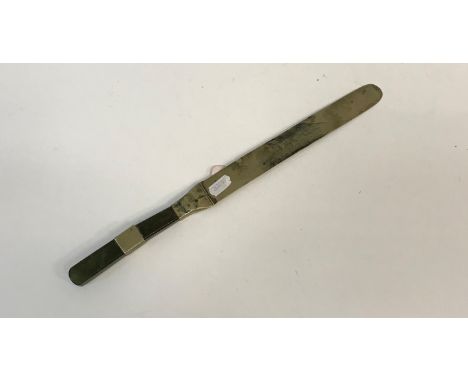 A 19th Century Chinese paperknife with jade and white metal banded handle and white metal blade, 37 cm long