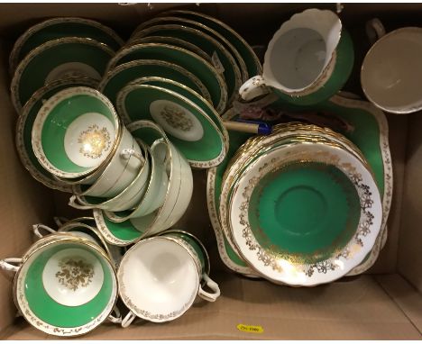 A set of 12 Royal Worcester set of twelve coffee cans and saucers (some with staining and damage), together with a Staffordsh
