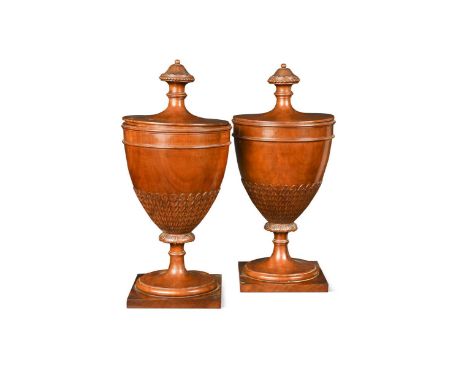 A pair of George III style mahogany urns with covers, the covers with fluted finials with beaded edge, the tapered ring turne
