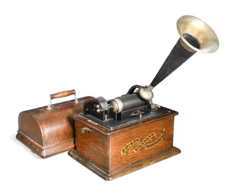 An Edison Standard cylinder phonograph,  patents to 1903, oak cased with horn33cm wideworn finish in places; spring seems qui