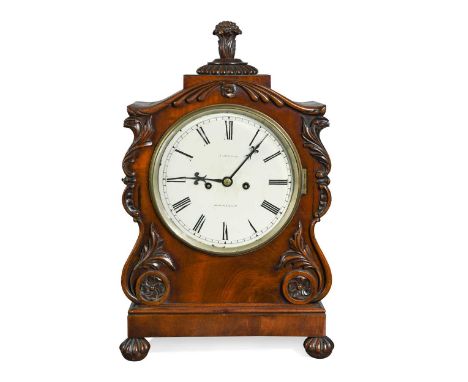 A William IV mahogany fusee table clock signed 'Jordan, Manchester', the scroll moulded and shaped case with finial above 20c