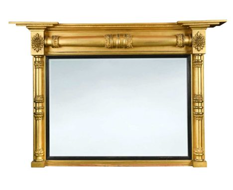 A giltwood overmantel mirror, 19th century, the rectangular bevelled plate flanked by ring turned columns with acanthus colla