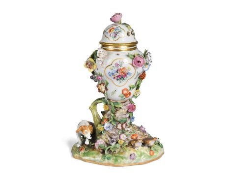 A Meissen encrusted porcelain rococo pot-pourri vase and cover, 19th century, of ogee form, raised on a rocky outcrop flanked